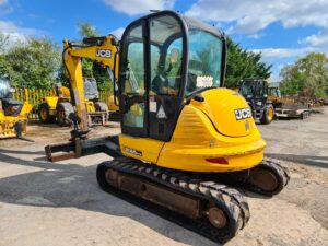 2010 JCB 8065, Hydraulic Quick hitch, Piped for attachments, Good rubber tracks, 7120 hours, Nice machine for its age.-image